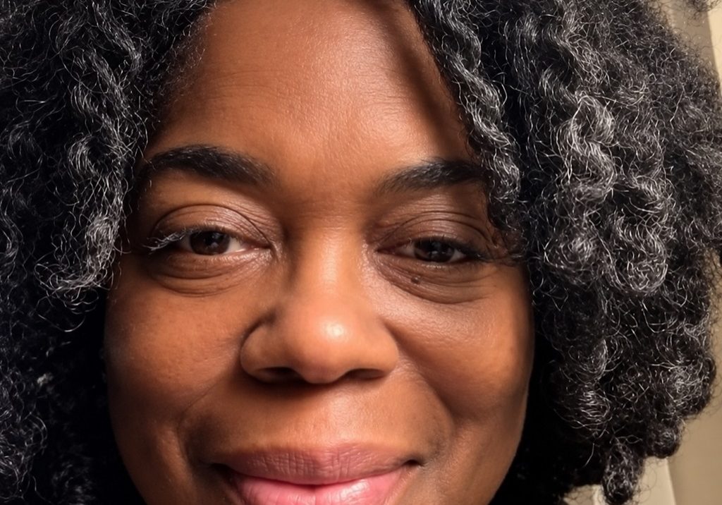 Brenda Jones smiling in a close portrait, reflecting on public service, civic trust, and collective action